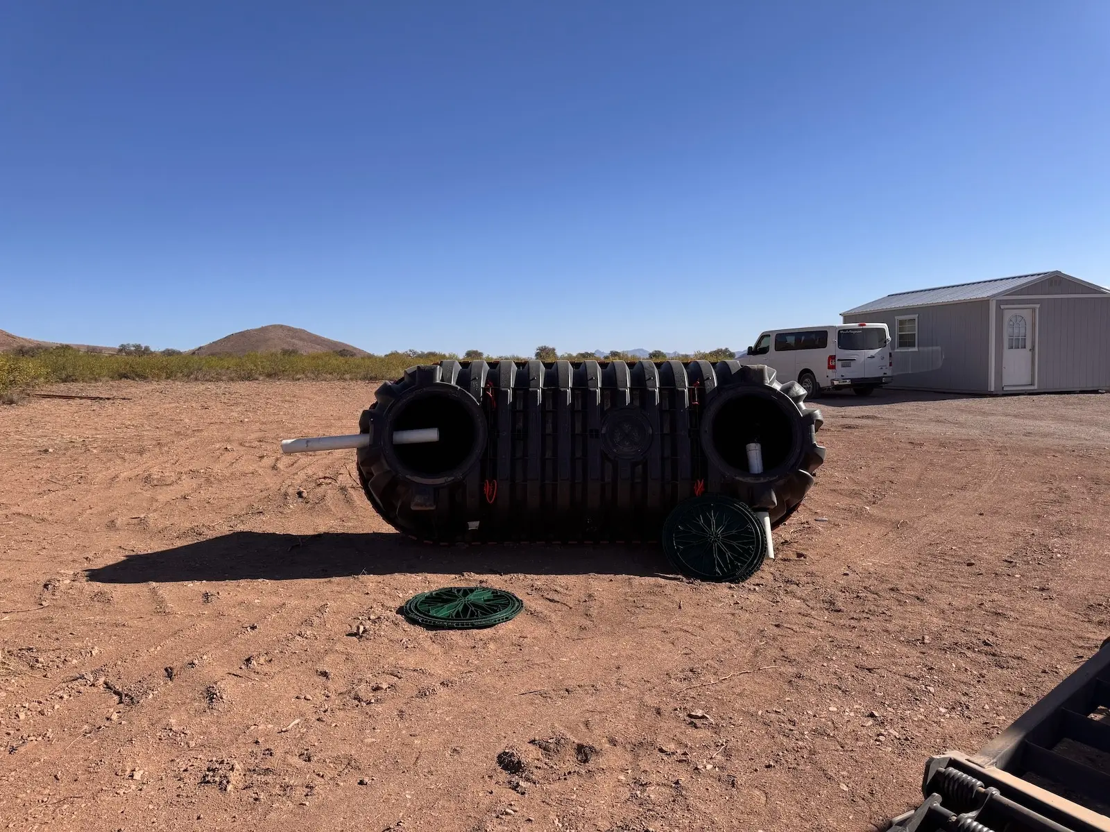 The septic tank, 1200 gallons