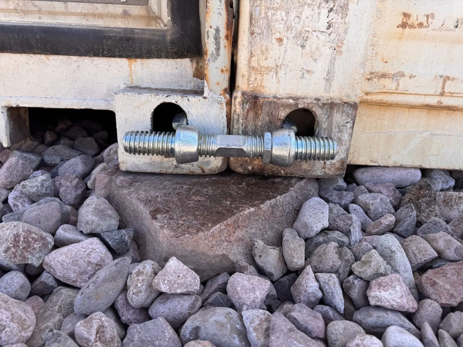 Big bolts holding the containers together