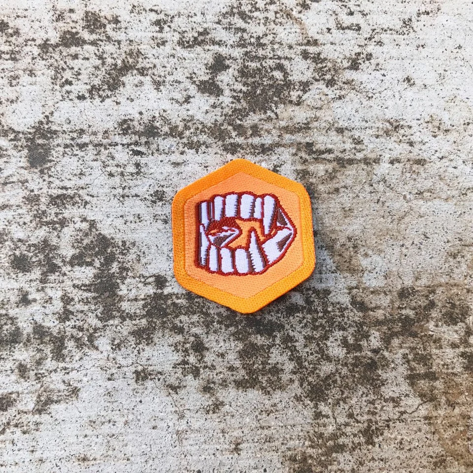 Plastic Fangs Badge